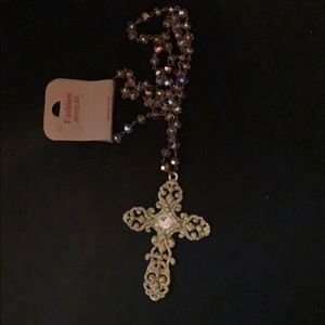 Long crystal necklace with a cross